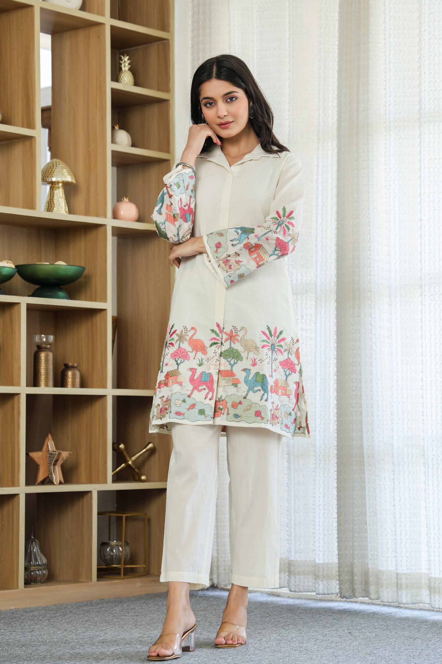 Woman wearing ivory color multi color embroided cotton coord set