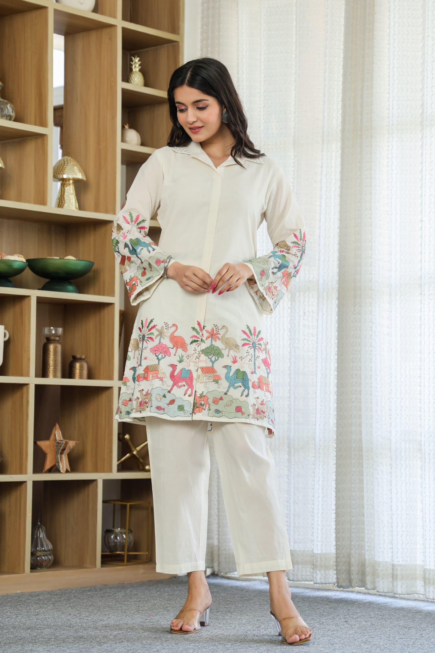 Woman wearing ivory color multi color embroided cotton coord set