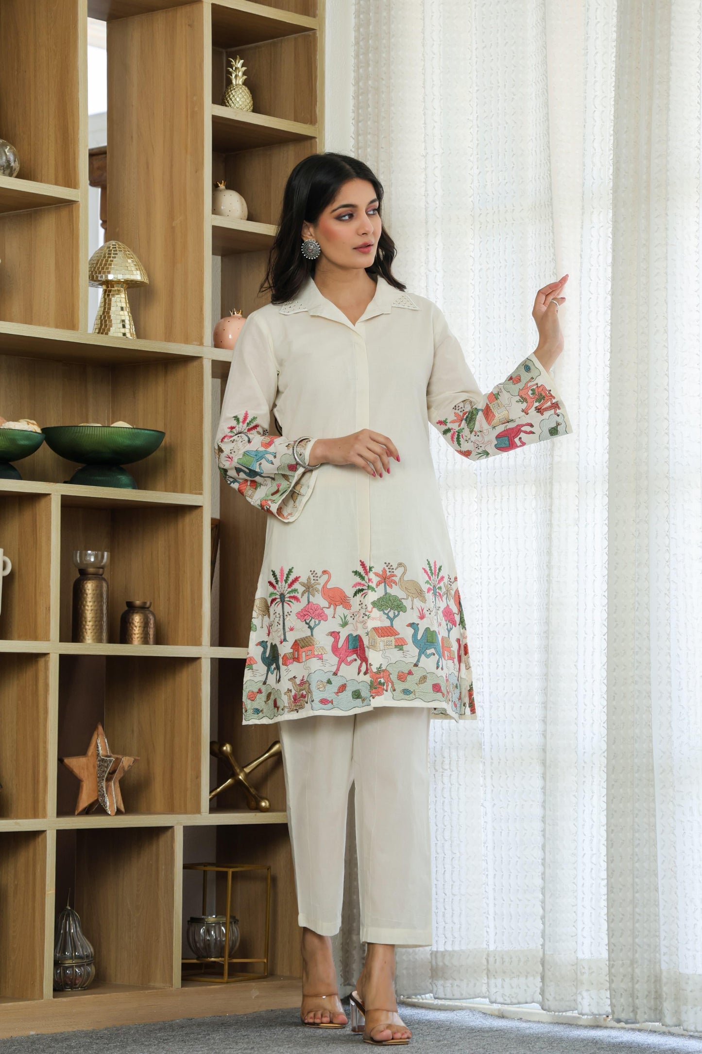 Woman wearing ivory color multi color embroided cotton coord set