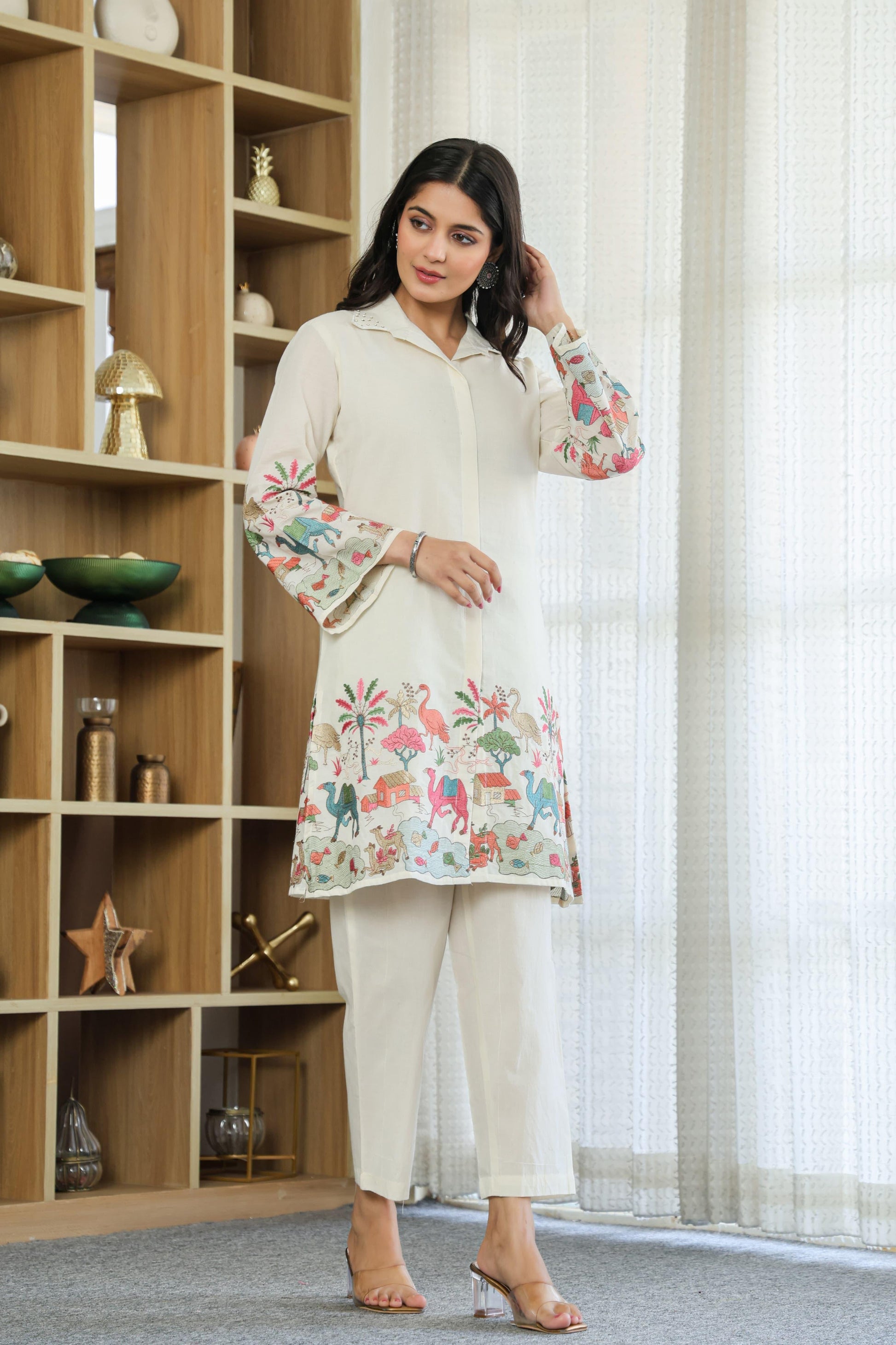 Woman wearing ivory color multi color embroided cotton coord set