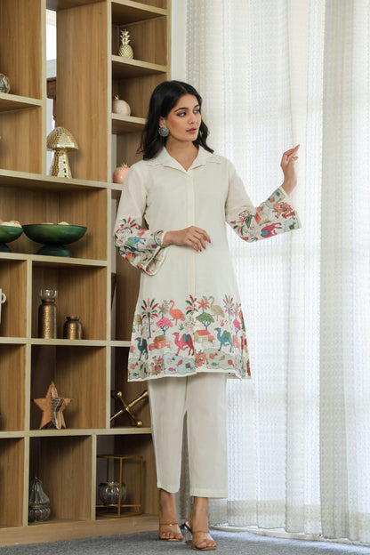 Woman wearing ivory color multi color embroided cotton coord set